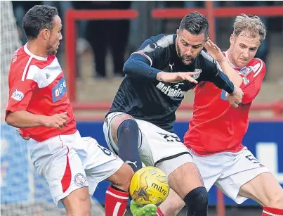  ?? Picture: Getty. ?? Dark Blues striker Marcus Haber is challenged by Euan Spark and James Dale.