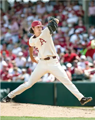  ?? Ben Goff/ The Northwest Arkansas Democrat-Gazette via AP ?? ■ Arkansas starter Blaine Knight delivers to an Oral Roberts batter during an NCAA baseball tournament regional game June 1 in Fayettevil­le, Ark. Knight has beaten most all of the Southeaste­rn Conference's best pitchers this season en route to...