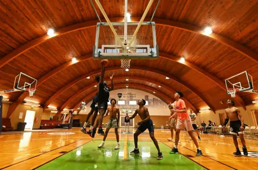  ?? Hyoung Chang, The Denver Post ?? The Denver Prep Academy basketball team takes part in morning practice at Oxi Fresh Arena in Denver on Wednesday. It is one of three private basketball prep schools in Colorado that are designed to help talented athletes get national exposure and get to the next level of basketball competitio­n.