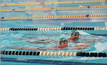  ?? PICTURE: MOTSHWARI MOFOKENG ?? CHUFFED: Ferlan Petzer, 12, and Chad le Clos, have time for a smile during their mini training session at Durban’s Kings Park swimming pool on Thursday. The Reach for a Dream Foundation made Petzer’s dream, which was to meet the Olympian, come true.