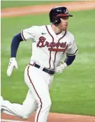  ?? TIM HEITMAN/USA TODAY SPORTS ?? Braves first baseman Freddie Freeman (5) runs on a double against the Dodgers during Game 5 of the 2020 NLCS.