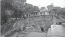  ?? THOKO CHIKONDI/AP ?? A road connecting the cities of Blantyre and Lilongwe in Malawi shows heavy damage Tuesday from the rains brought by Tropical Cyclone Freddy.