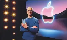  ?? Reuters ?? Apple CEO Tim Cook holds the iPhone 13 Pro Max and Apple ■ Watch Series 7 during a special event in Cupertino, on Tuesday.