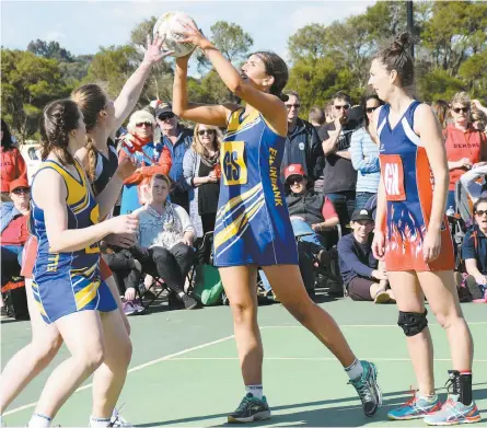 ??  ?? Tense times in the exciting A grade grand final as Ellinbank goal shooter Tess Steinfort takes a shot. Others pictured, from left, are Ellinbank’s Stephanie Milner and Koo wee rup defenders Alexis Bell and Sheena Clarke.