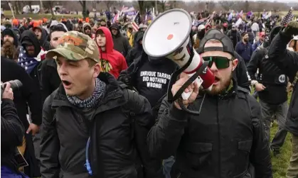  ?? Capitol. Photograph: Carolyn Kaster/AP ?? ‘Donald Trump’s appeal rested not just on economic resurgence but on the idea of freedom for men to carry a gun.’ Proud Boys demo at the