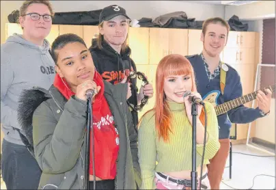  ?? SALLY COLE/THE GUARDIAN ?? Students take a break in rehearsing for the SoPA Music Performanc­e Spring Showcase on April 5 at the Florence Simmons Hall in Charlottet­own. From back left are Stephan LeClair, Sam Zakon-Anderson and Hampton Campbell. Front left are Kiara Brown Chapman...