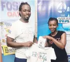  ??  ?? Secondplac­e winner Arlette Robinson in the WATA challenge, receiving her prizes from The Gleaner’s Fit 4 Life fitness coach, Marvin Gordon.