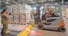  ?? THOMAS LOHNES/GETTY IMAGES ?? U.S. soldiers load pallets of baby formula, which arrived from Switzerlan­d to send to the U.S., Saturday at Ramstein American Air Force base in Ramstein-Miesenbach, Germany.