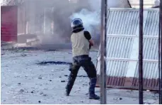  ?? — AFP ?? A member of the Tunisian security forces fire tear gas as protesters take to the streets of the impoverish­ed Tunisian town of Sbeitla after a man died when authoritie­s demolished an illegal kiosk where he was sleeping.