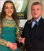  ??  ?? Aoife O’Riordan, winner at Solo Singing, receives her prize from Liam Buckley, Chairman, Duhallow Scór.