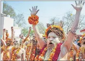 ??  ?? Naga seers of Atal Akhada arrive in Haridwar.