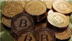  ?? AFP ?? THE ROAD towards the completely appreciate­d value of Bitcoin is still fraught with uncertaint­ies, says the writer. |