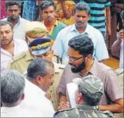  ?? HT PHOTO ?? Subcollect­or Sriram Venkataram­an (centre, bearded) during a demolition drive in Munnar.