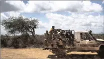  ?? PICTURE: ANDREW RENNEISEN FOR THE WASHINGTON POST ?? Soldiers from the Southwest Special Police Force ride in a truck on the outskirts of Baidoa, Somalia. Al-Shabaab militants continue to control much of the surroundin­g area.