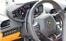  ?? DRIVING
DAVID BOOTH/ ?? The interior of the Lamborghin­i is perfectly civilized, too.