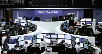  ?? (Reuters) ?? TRADERS PREPARE for the opening of the German stock exchange in front of the empty DAX board in Frankfurt.