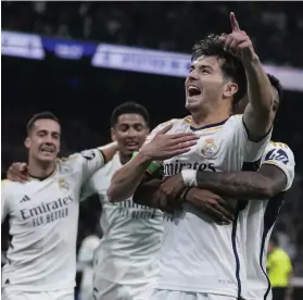  ?? AP ?? Real Madrid midfielder Brahim Diaz celebrates with teammates after scoring the opening goal in their La Liga draw with Atletico Madrid on Sunday