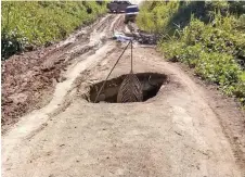  ?? ?? One of the many potholes along the road to Long Jegan.