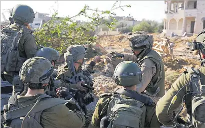  ?? Picture: Israel Defense Forces/Handout via REUTERS ?? Israeli soldiers operate in the Gaza Strip amid the ongoing conflict between Israel and the Palestinia­n Islamist group Hamas, in this undated handout picture released on February 24.