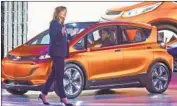  ?? Tony Ding Associated Press ?? GM CEO Mary Barra and the Chevy Bolt, which hasn’t sold well in California since its 2017 debut.