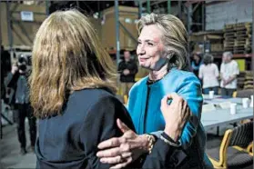  ?? ANDREW BURTON/GETTY ?? Democratic presidenti­al candidate Hillary Rodham Clinton campaigns Monday after a roundtable discussion at a company in Keene, N.H., that makes furniture for children.