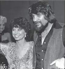  ?? Associated Press photo ?? In this 1982 file photo, country music legend Waylon Jennings, right, and his wife, country singer Jessi Colter, attend a party in Nashville, Tenn. Colter was one of the few women at the centre of the outlaw movement, which she chronicles in her new...