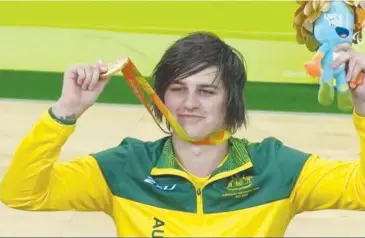  ??  ?? Jayden holds his coveted Paralympic medal up to the crowd after the Aussie Steelers thrilling one goal victory in 2016 over the USA. (Courtesy Channel 7)