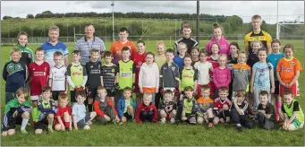  ??  ?? Coaches and players at the Bunninadde­n skills camp.