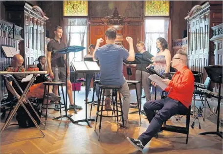  ?? Photograph­s by Carolyn Cole Los Angeles Times ?? PETER SELLARS, right, rehearses in New York last week. The festival opens with a staging of Kaija Saariaho’s “La Passion de Simone.”