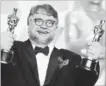  ?? JORDAN STRAUSS
THE ASSOCIATED PRESS ?? Guillermo del Toro celebrates his Oscar wins for best director and best picture.