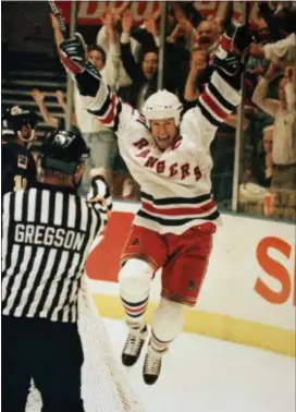  ?? RON FREHM — THE ASSOCIATED PRESS ?? This June 14, 1994 file photo shows Rangers’ Mark Messier celebratin­g his second period goal against the Vancouver Canucks in Game 7 of the Stanley Cup Finals at New York’s Madison Square Garden.