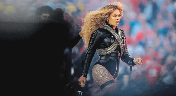  ?? RONALD MARTINEZ GETTY ?? Beyoncé used her performanc­e during the Super Bowl 50 halftime show in 2016 to make a statement about Black Lives Matter.
