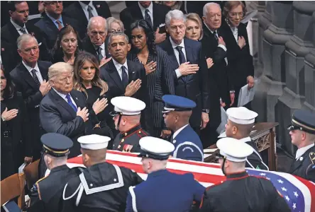  ?? JACK GRUBER/USA TODAY ?? Presidents Donald Trump, Barack Obama, Bill Clinton and Jimmy Carter pay their respects.