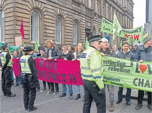  ??  ?? RALLY: Extinction Rebellion demonstrat­ors will take to the street in Aberdeen and outside a petrol station in Fort William