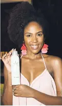  ??  ?? Diedre McKenzie, with herbal workable hairspray medium hold, says it works great for her hair.