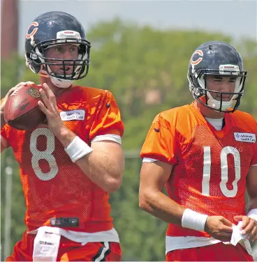  ?? JOHN KRYK / POSTMEDIA NEWS ?? Mike Glennon, left, has rendered No. 2 overall pick Mitchell Trubisky to an understudy role with his early poise at the Chicago Bears training camp.