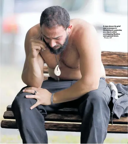  ?? Photo / AP ?? A man shows his grief near a mosque in Christchur­ch yesterday on a day in which worshippin­g Muslims were gunned down.