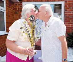  ??  ?? Enid and Geoff Harvey celebrate. Ref:132801-14