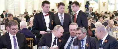  ?? (Sputnik/Reuters) ?? RUSSIAN PRESIDENT Vladimir Putin, Serbian President Aleksandar Vucic, MK Ze’ev Elkin and Prime Minister Benjamin Netanyahu at a Victory Day reception at the Kremlin in May.