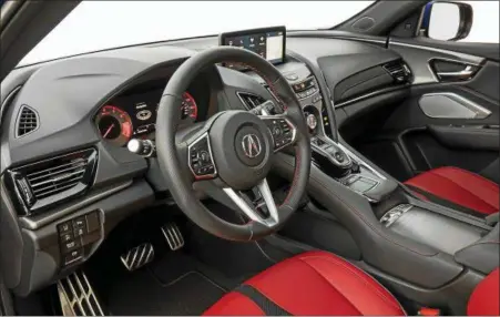  ??  ?? The interior is high-end, using real metal and wood and quality leather.