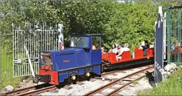  ?? Photo: Donald Brooks ?? n The final return train on the first-ever day of public operation on the Astley Green Colliery Railway, hauled by 4wDH ‘Newton’, passes through symbolic open gates, newly installed as part of the security for the Greater Manchester museum complex. The railway opened on 30th May – a detailed report of the event is on page 15.