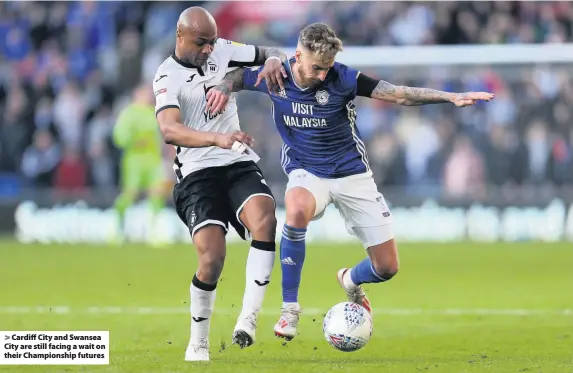  ??  ?? > Cardiff City and Swansea City are still facing a wait on their Championsh­ip futures