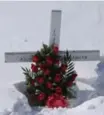  ??  ?? This cross made by a resident of Moose Factory stands at Jonnish Saganash’s long-unmarked grave.