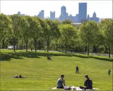  ??  ?? People enjoy the warm weather Wednesday in Schenley Park.