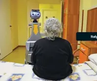  ??  ?? A robot being tested by Robot-Era has been programmed to accompany a woman to the dining room at a nursing home in Florence.Italy