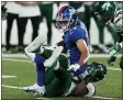  ?? FRANK FRANKLIN II - THE ASSOCIATED PRESS East Rutherford, N.J. ?? New York Giants wide receiver Dante Pettis (13) is tackled by New York Jets inside linebacker C.J. Mosley, below, in the first half of an NFL preseason football game, Saturday, Aug. 14, 2021, in