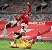  ??  ?? Mason Greenwood scores one of his two goals for Manchester United.