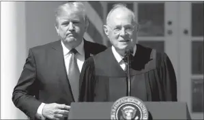  ?? CAROLYN KASTER / ASSOCIATED PRESS FILE (2017) ?? President Donald Trump stands behind and Supreme Court Justice Anthony Kennedy during a public swearing-in ceremony for Justice Neil Gorsuch on April 10, 2017, at the White House.