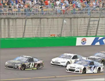  ?? Timothy D. Easley/AP ?? Kurt Busch (41) leads the field following a restart during the NASCAR Sprint Cup Series auto race at Kentucky Speedway, Saturday, July 9, 2016 in Sparta, Ky.