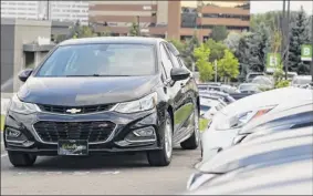  ?? David Zalubowski / Associated Press ?? Prices of used small cars are on the rise after falling for the past five years. Black Book reports that sales of used compact and subcompact cars each are up 5 percent in the first quarter from a year earlier.